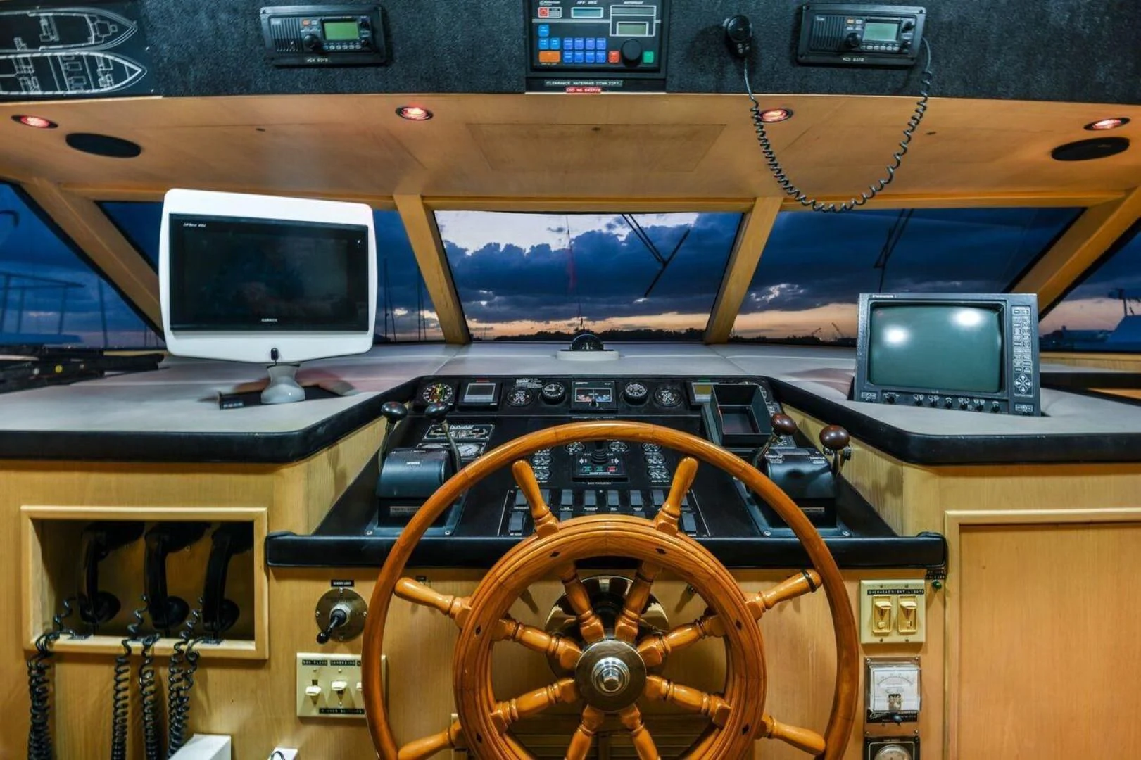 a wooden car with a steering wheel aboard PRIMETIME III Yacht for Sale