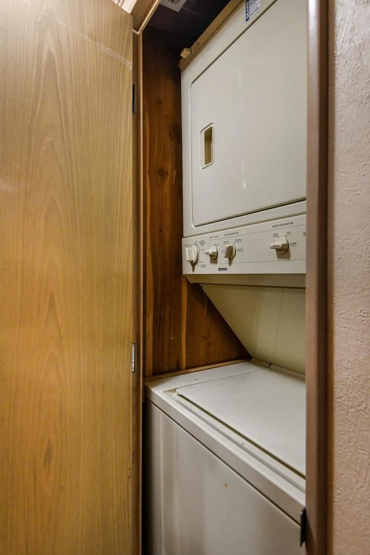 a white washing machine aboard PRIMETIME III Yacht for Sale