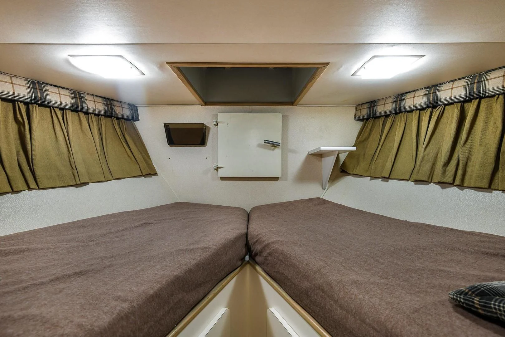 a room with two beds aboard PRIMETIME III Yacht for Sale