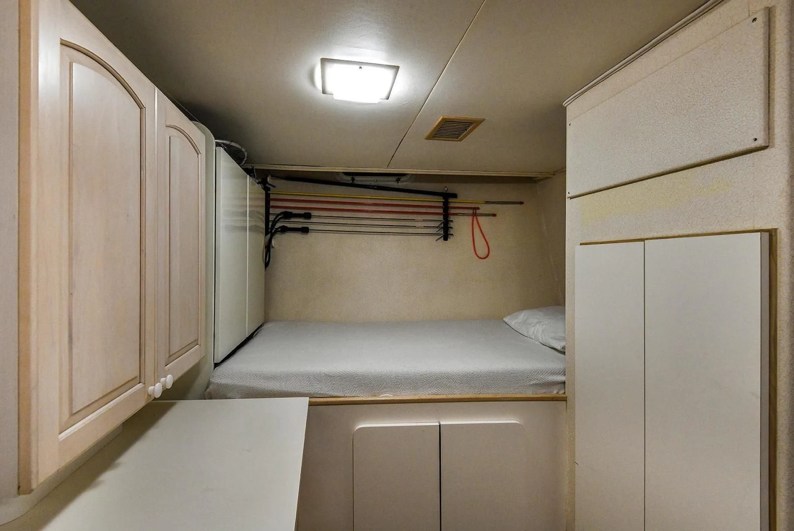 a bed in a room aboard PRIMETIME III Yacht for Sale