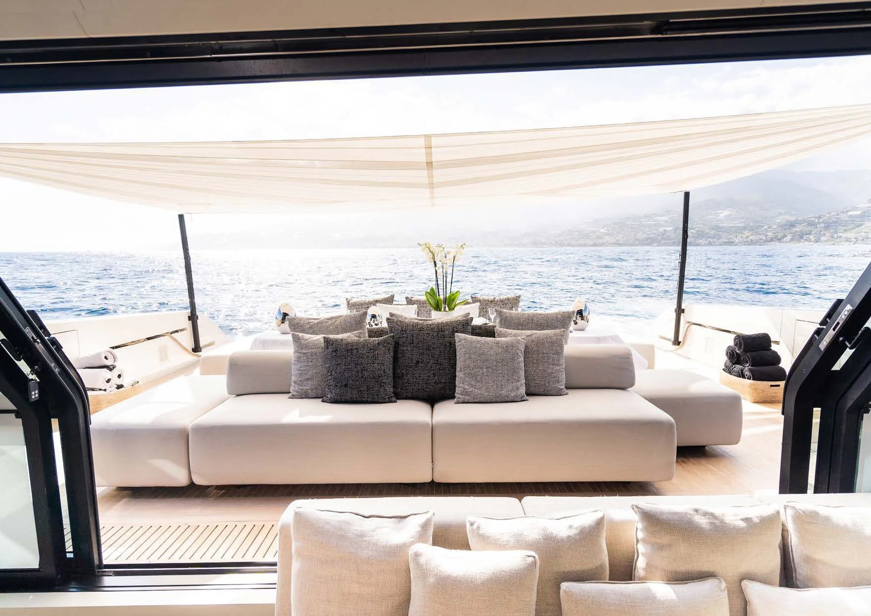 a couch with a plant on it aboard ANMAX Yacht for Sale