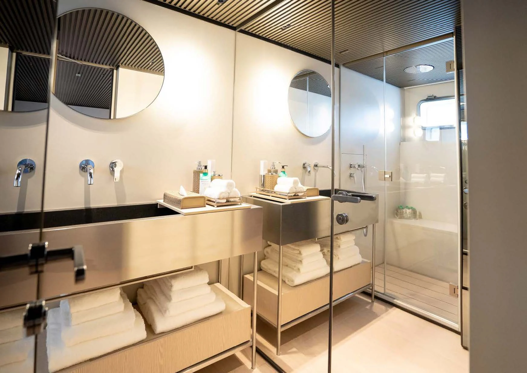 a bathroom with a large mirror aboard ANMAX Yacht for Sale