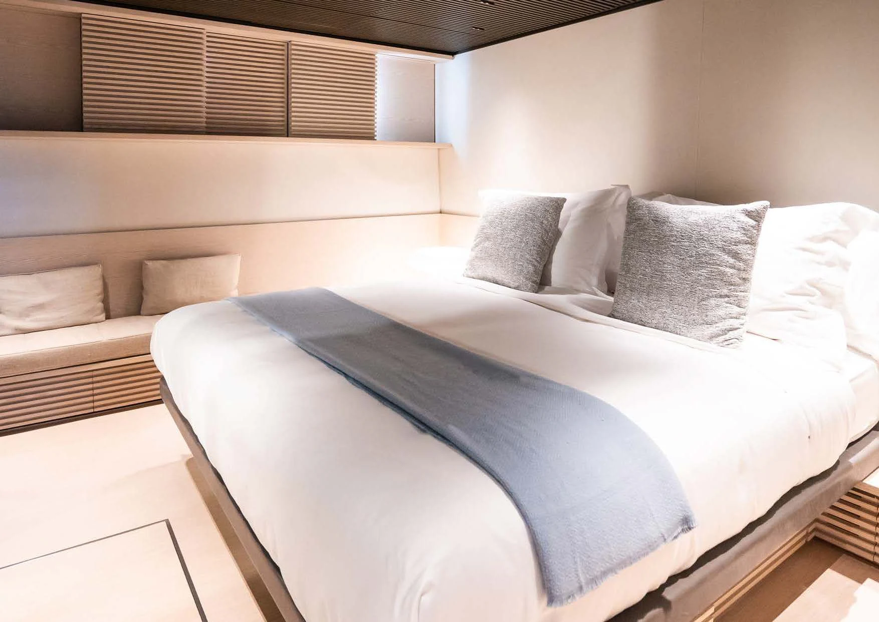 a bed with pillows aboard ANMAX Yacht for Sale