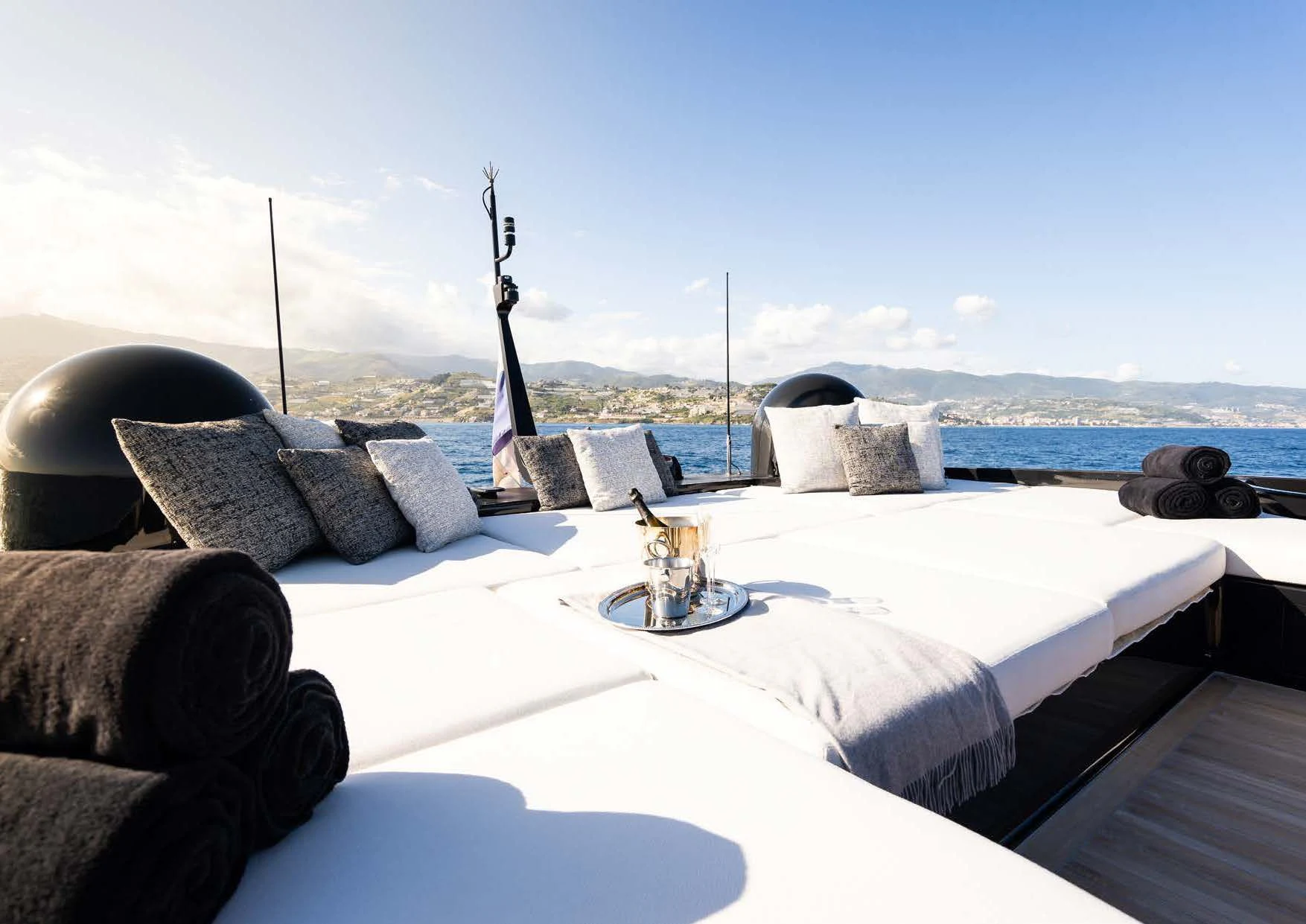 a table with pillows and a fountain aboard ANMAX Yacht for Sale