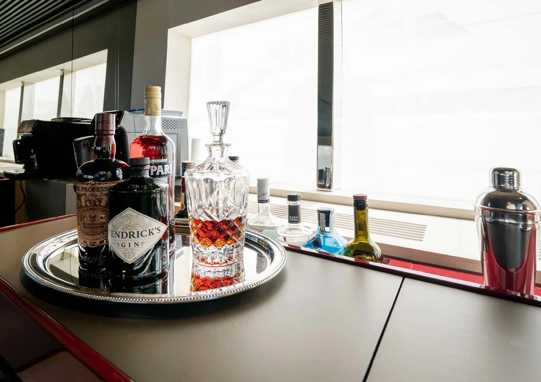 a glass bottle and a glass bottle on a table aboard ANMAX Yacht for Sale