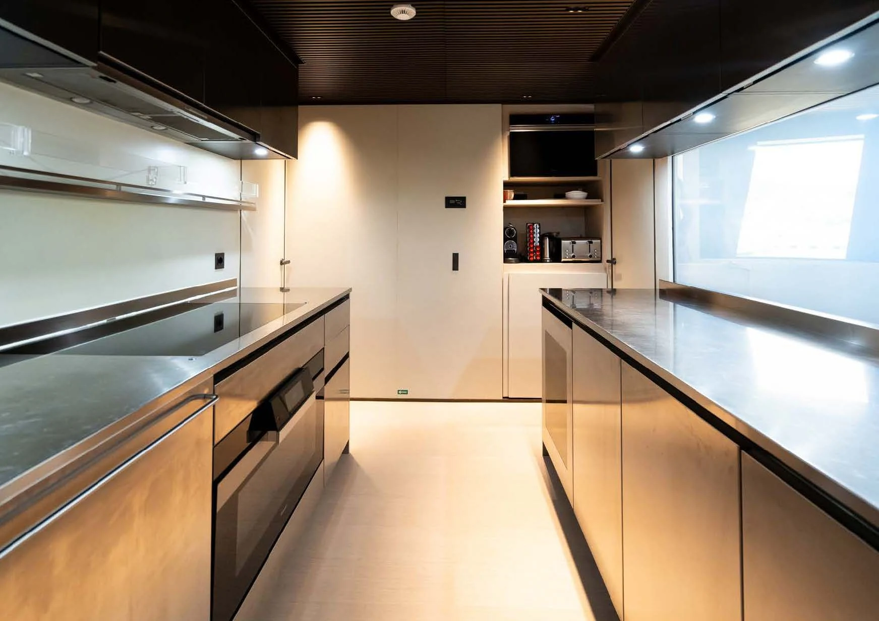 a kitchen with a large island aboard ANMAX Yacht for Sale