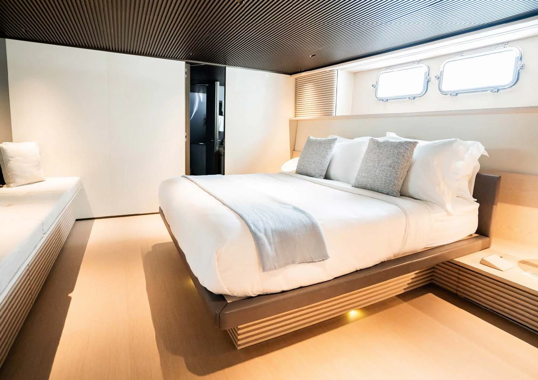 a bed with a white bed aboard ANMAX Yacht for Sale