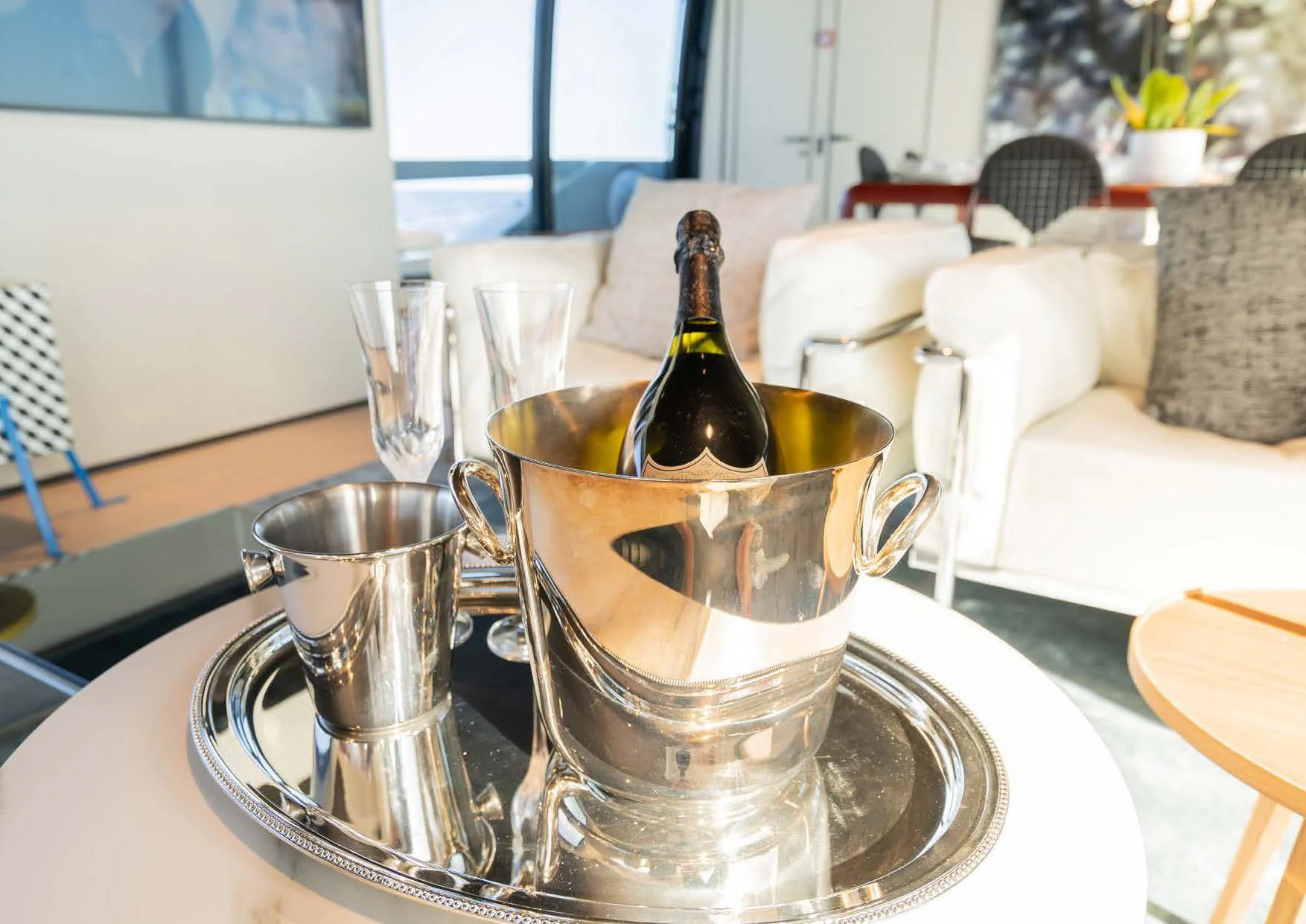 a glass of beer on a table aboard ANMAX Yacht for Sale