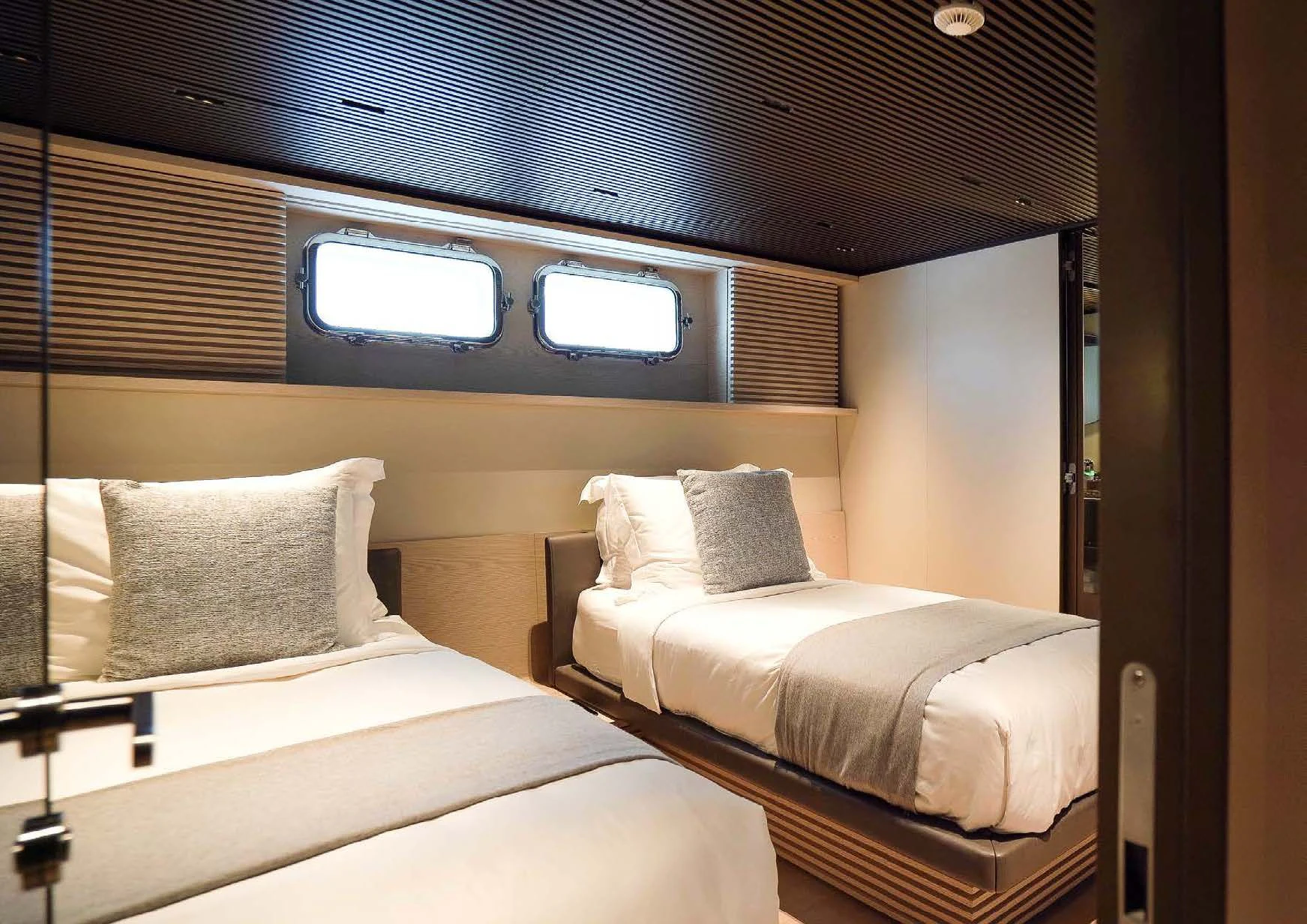 a couple of beds in a room aboard ANMAX Yacht for Sale