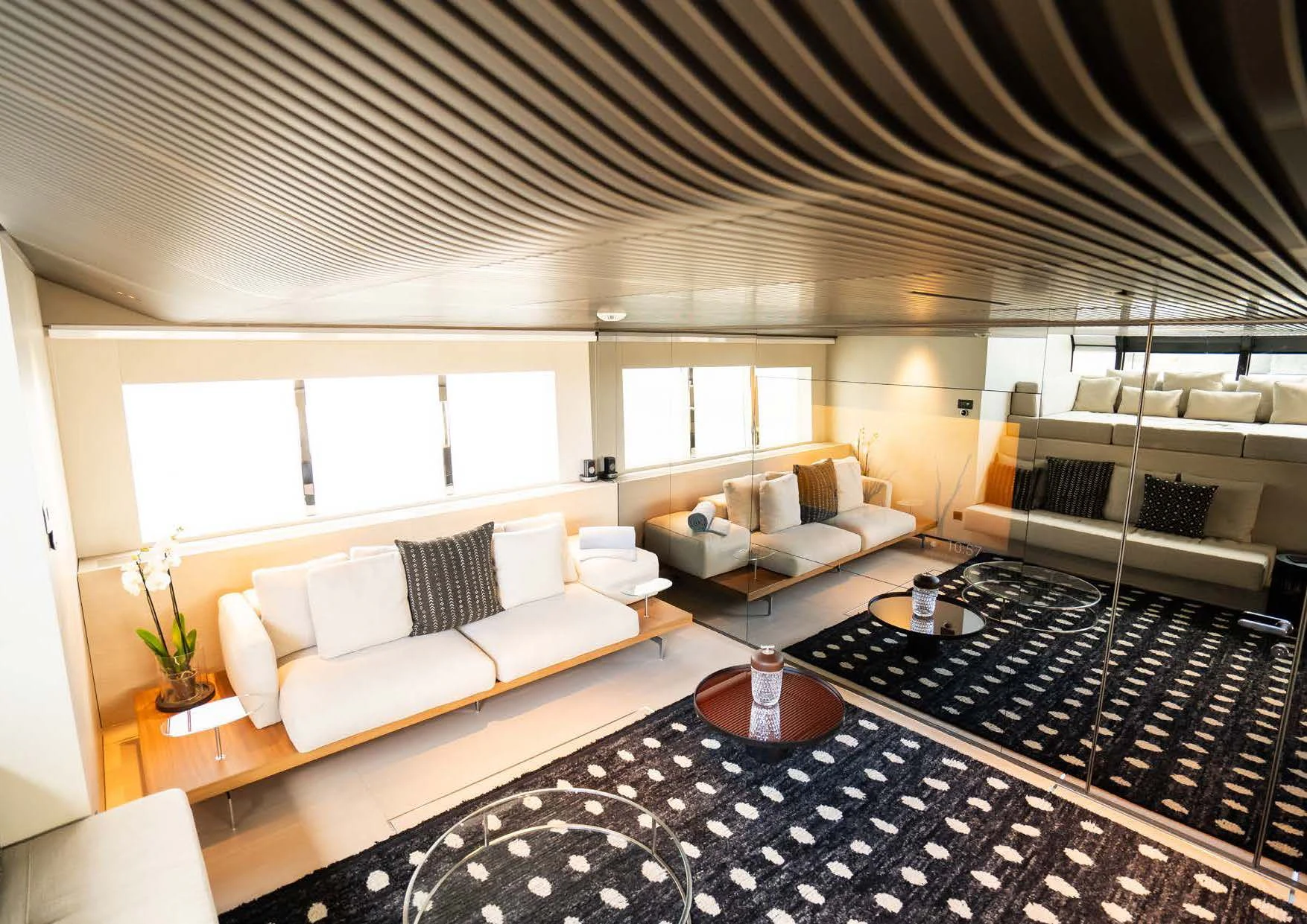 a large living room with a black and white rug aboard ANMAX Yacht for Sale