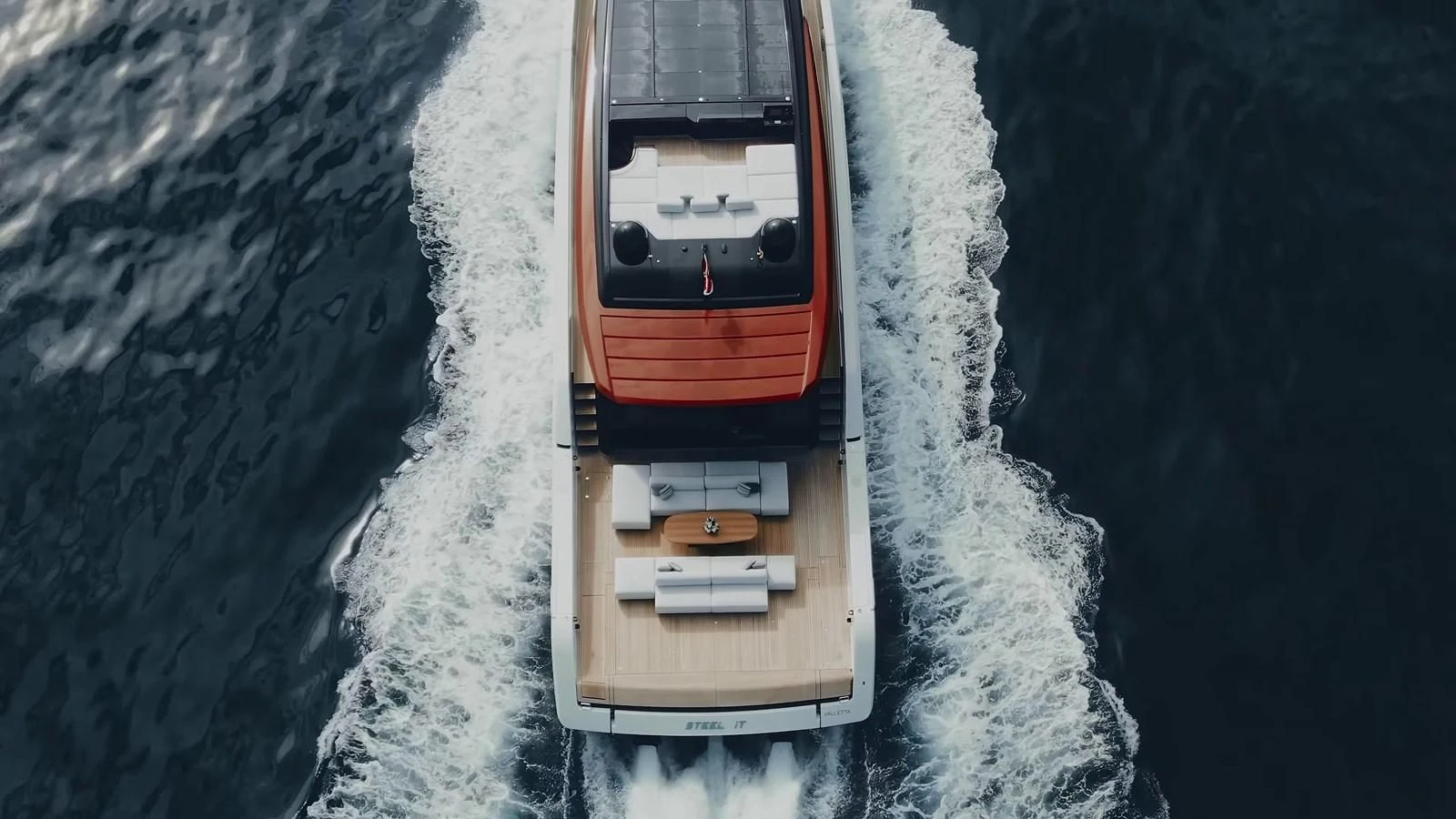 a small wooden boat on a body of water aboard ANMAX Yacht for Sale