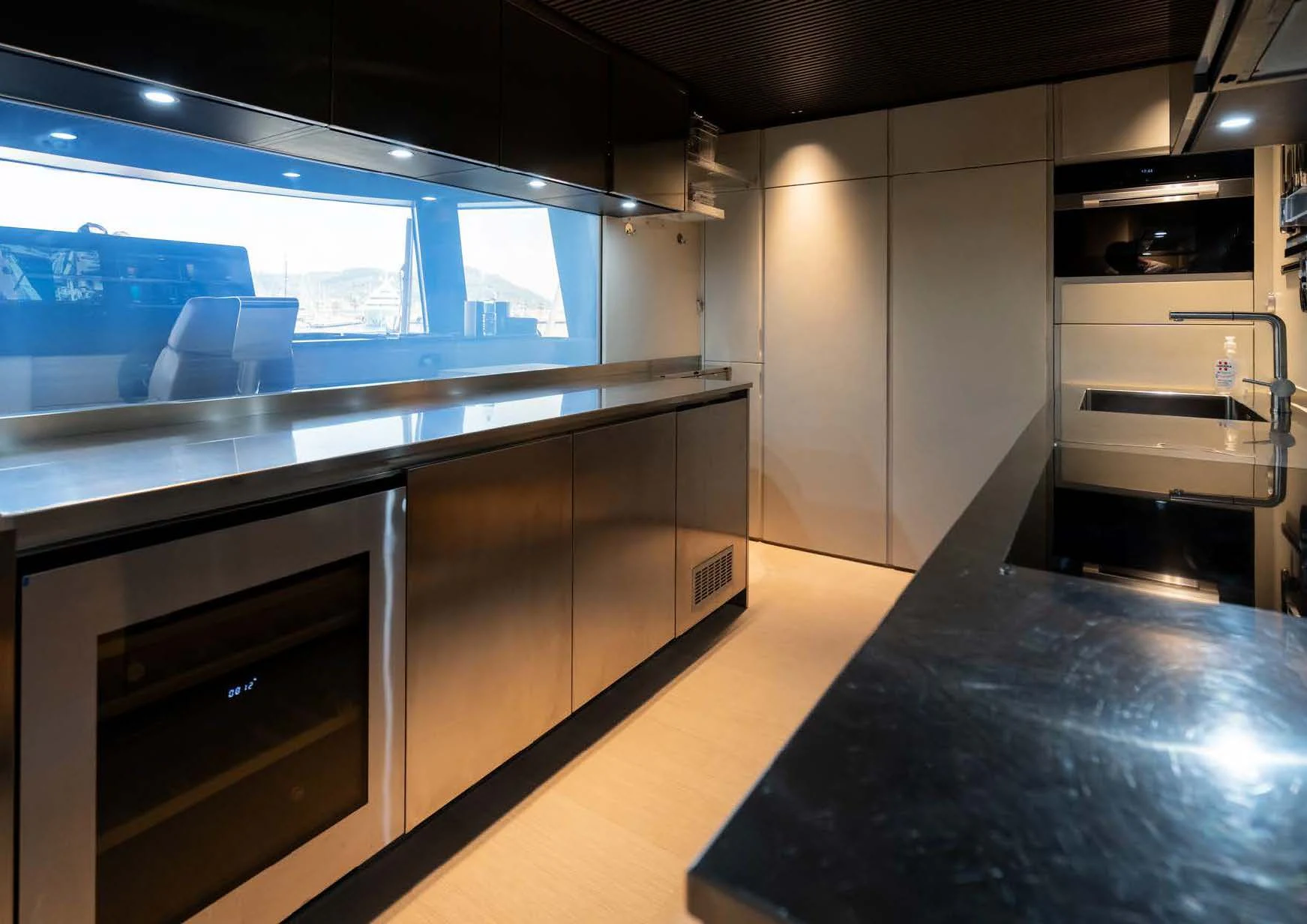 a kitchen with a large island aboard ANMAX Yacht for Sale
