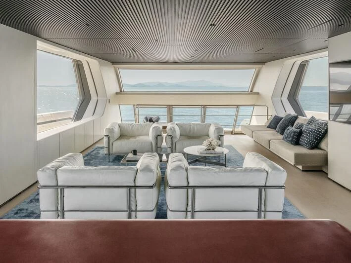 a living room with a couch and a table aboard ANMAX Yacht for Sale