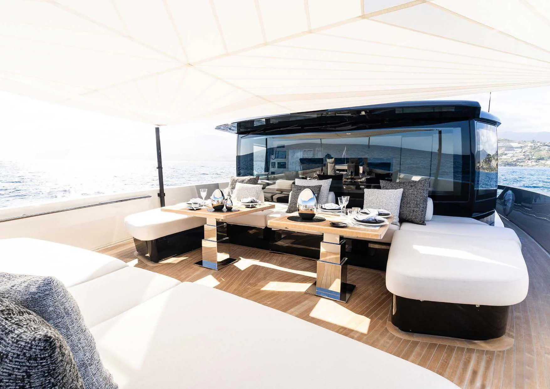 a large room with a large black and white lounge chair and a large black and white umbrella with aboard ANMAX Yacht for Sale