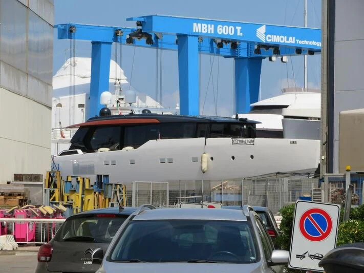 a white boat on a trailer aboard ANMAX Yacht for Sale