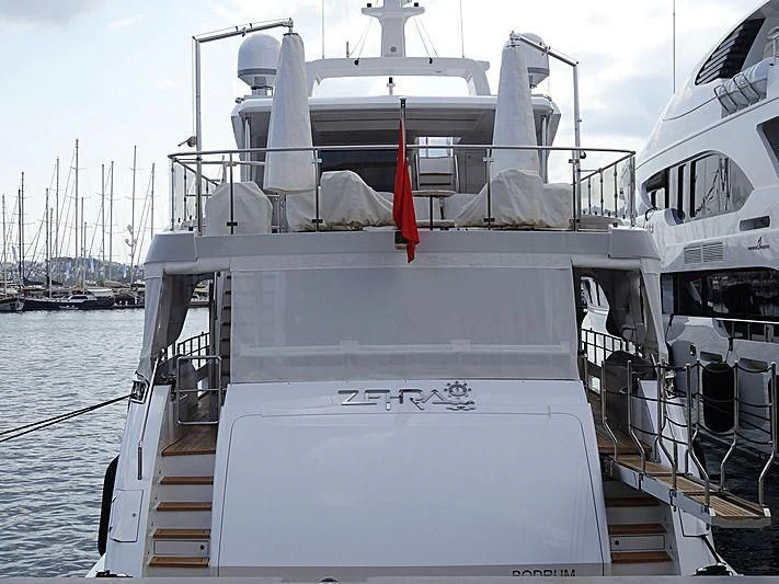 a boat with a red ribbon on the front aboard ZEHRA 1 Yacht for Sale