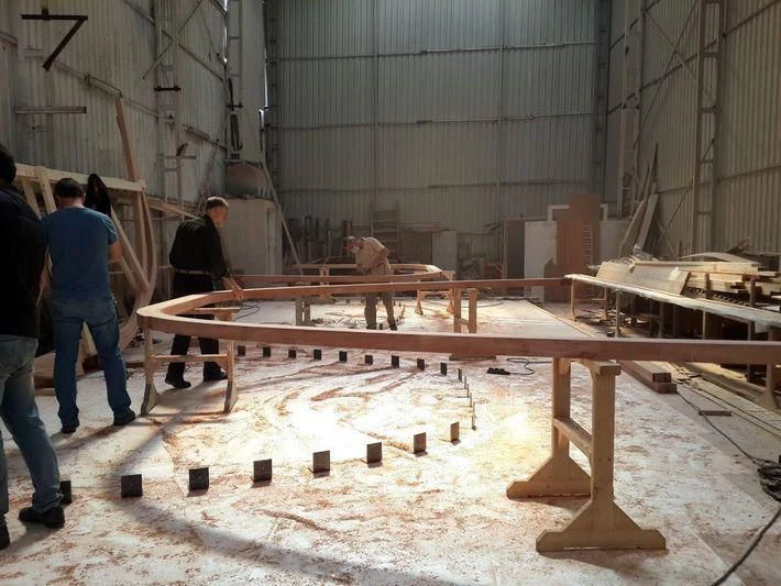 a group of people working on a wooden structure aboard VAGANTE Yacht for Sale