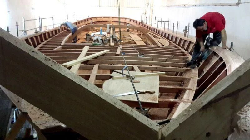 a few men working on a roof aboard VAGANTE Yacht for Sale