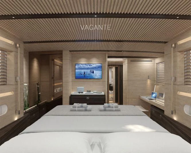 a room with a bed and a tv on the wall aboard VAGANTE Yacht for Sale