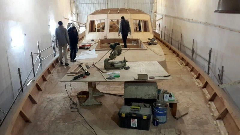 a person working on a project aboard VAGANTE Yacht for Sale