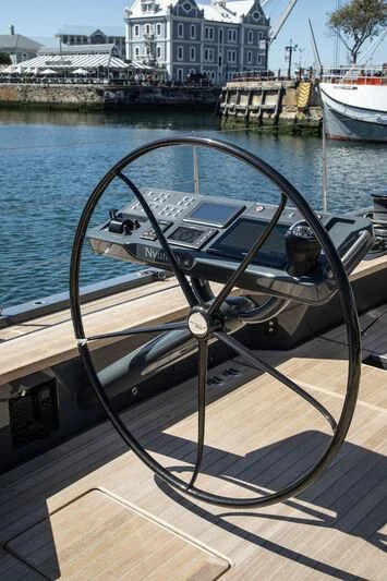 a steering wheel on a boat aboard NYUMBA GT Yacht for Sale
