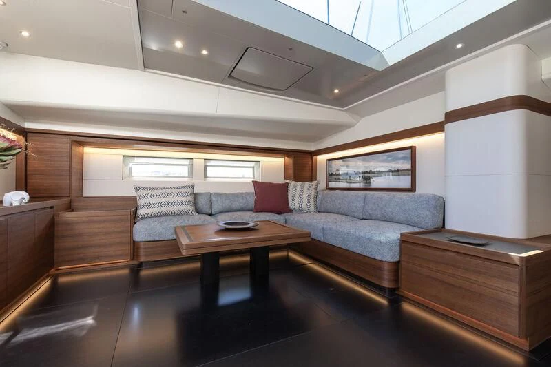 a living room with a couch and a coffee table aboard NYUMBA GT Yacht for Sale