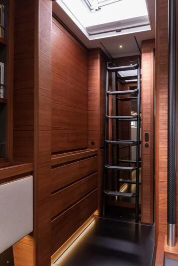 a wooden door with a glass frame aboard NYUMBA GT Yacht for Sale