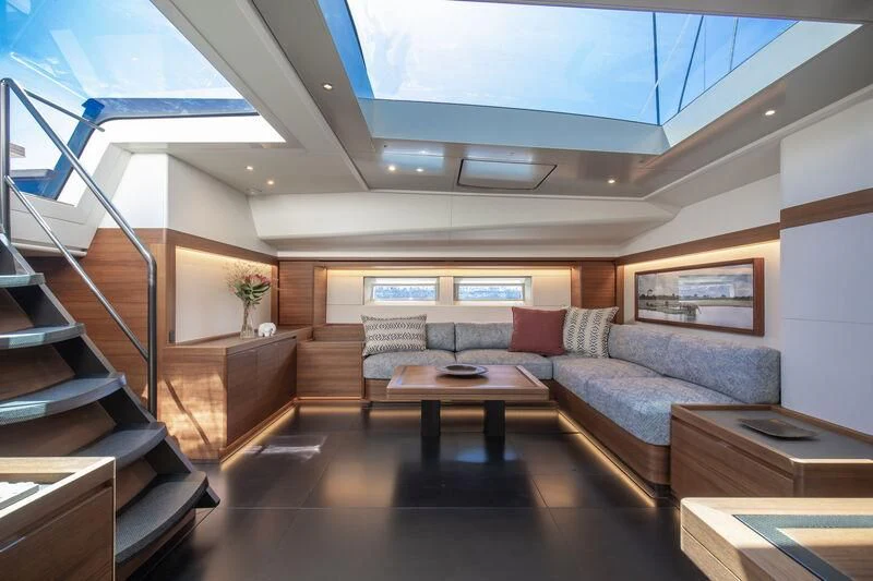 a living room with a large window aboard NYUMBA GT Yacht for Sale