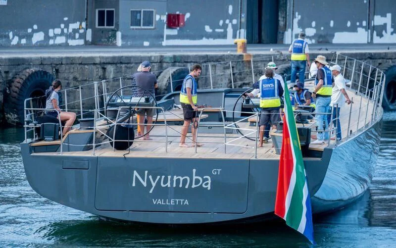 a group of people on a boat aboard NYUMBA GT Yacht for Sale