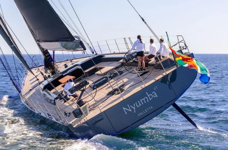 a group of people on a sailboat aboard NYUMBA GT Yacht for Sale
