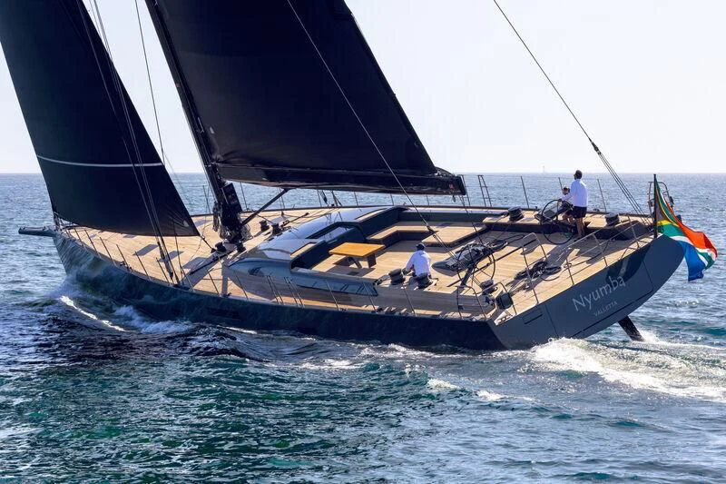 a person sailing on a sailboat aboard NYUMBA GT Yacht for Sale