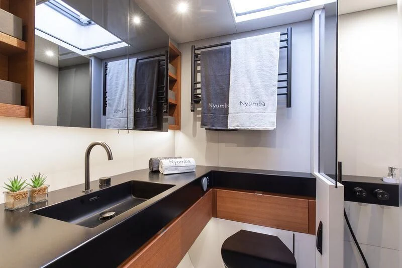 a kitchen with a large white board aboard NYUMBA GT Yacht for Sale