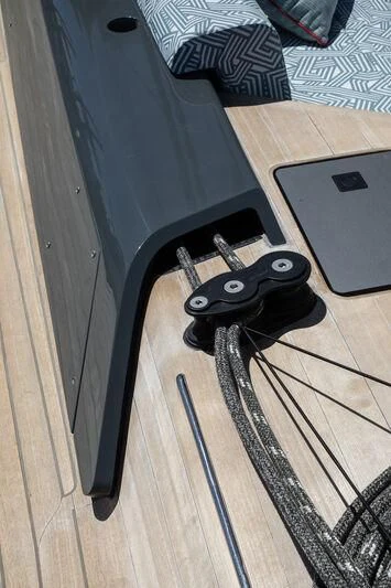 a black object on a wooden surface aboard NYUMBA GT Yacht for Sale