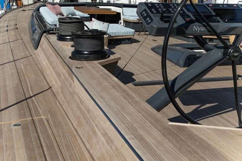a wood table with a grill on it aboard NYUMBA GT Yacht for Sale