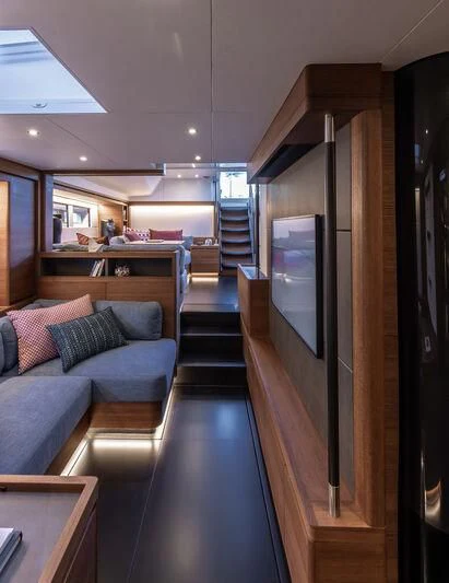 a room with a couch and a tv aboard NYUMBA GT Yacht for Sale