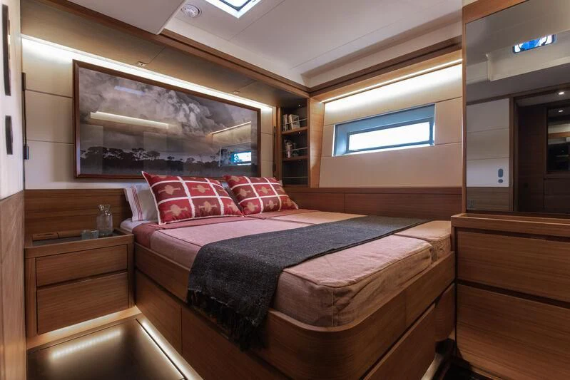 a bed in a room aboard NYUMBA GT Yacht for Sale