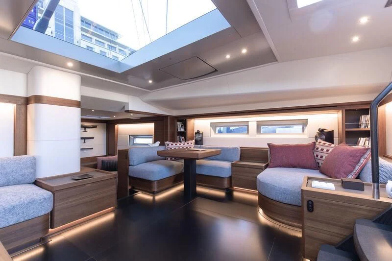 a room with a table and chairs aboard NYUMBA GT Yacht for Sale