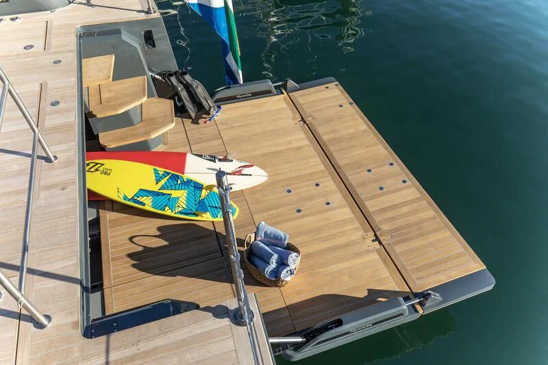 a table with a pool table and chairs aboard NYUMBA GT Yacht for Sale