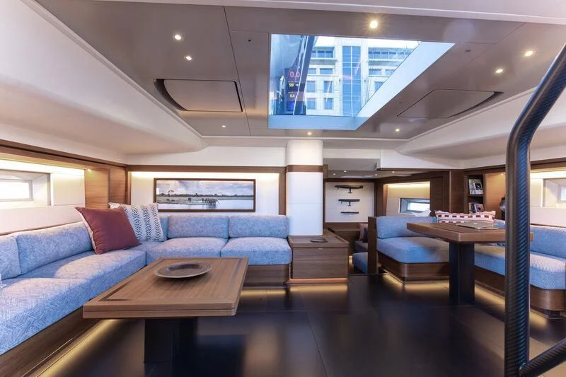 a living room with a couch and a table aboard NYUMBA GT Yacht for Sale