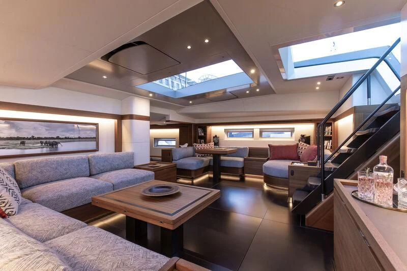 a living room with a large window aboard NYUMBA GT Yacht for Sale