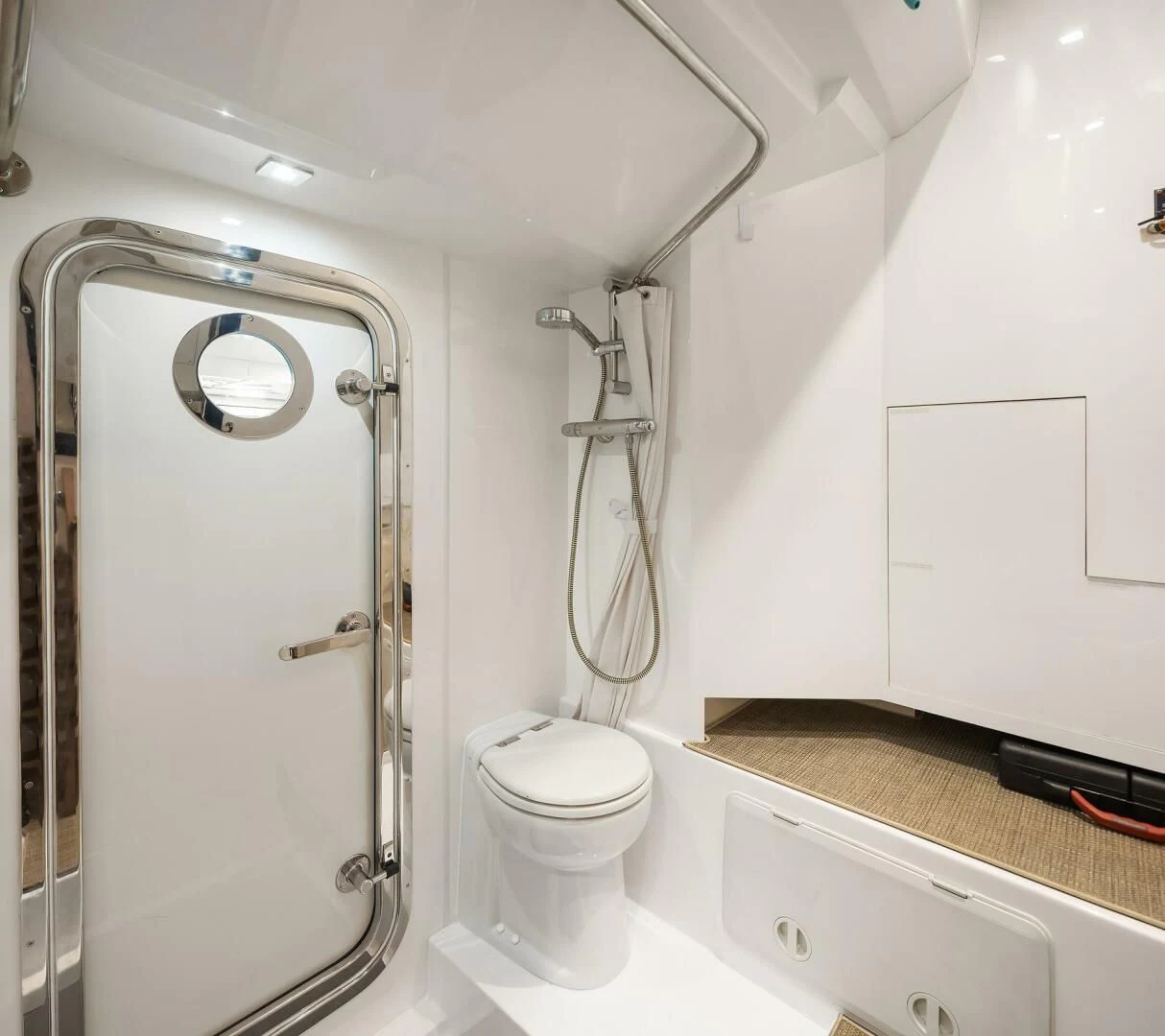 a bathroom with a toilet and a shower aboard PLAYBOOK Yacht for Sale