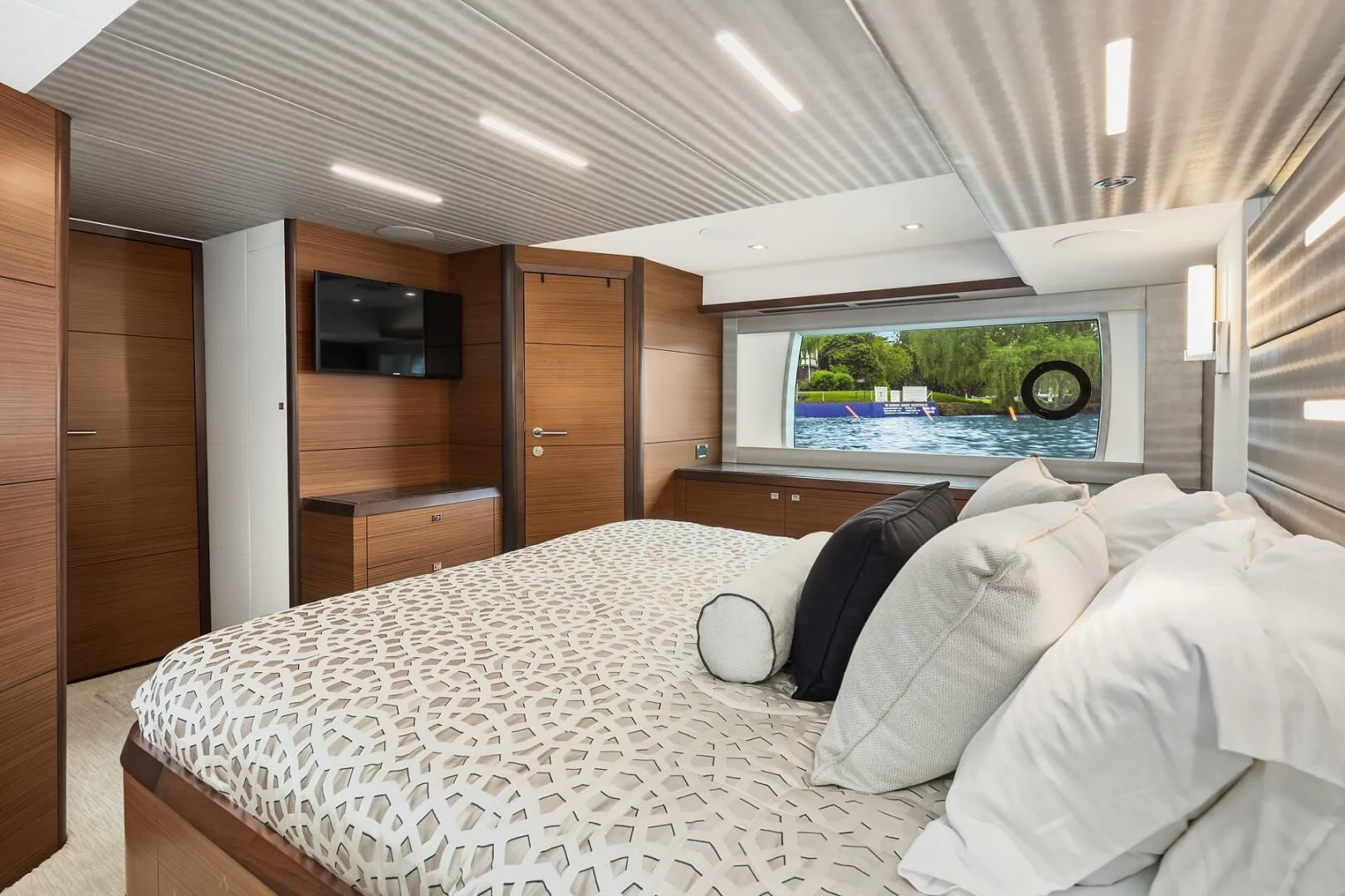a bed in a room aboard PLAYBOOK Yacht for Sale