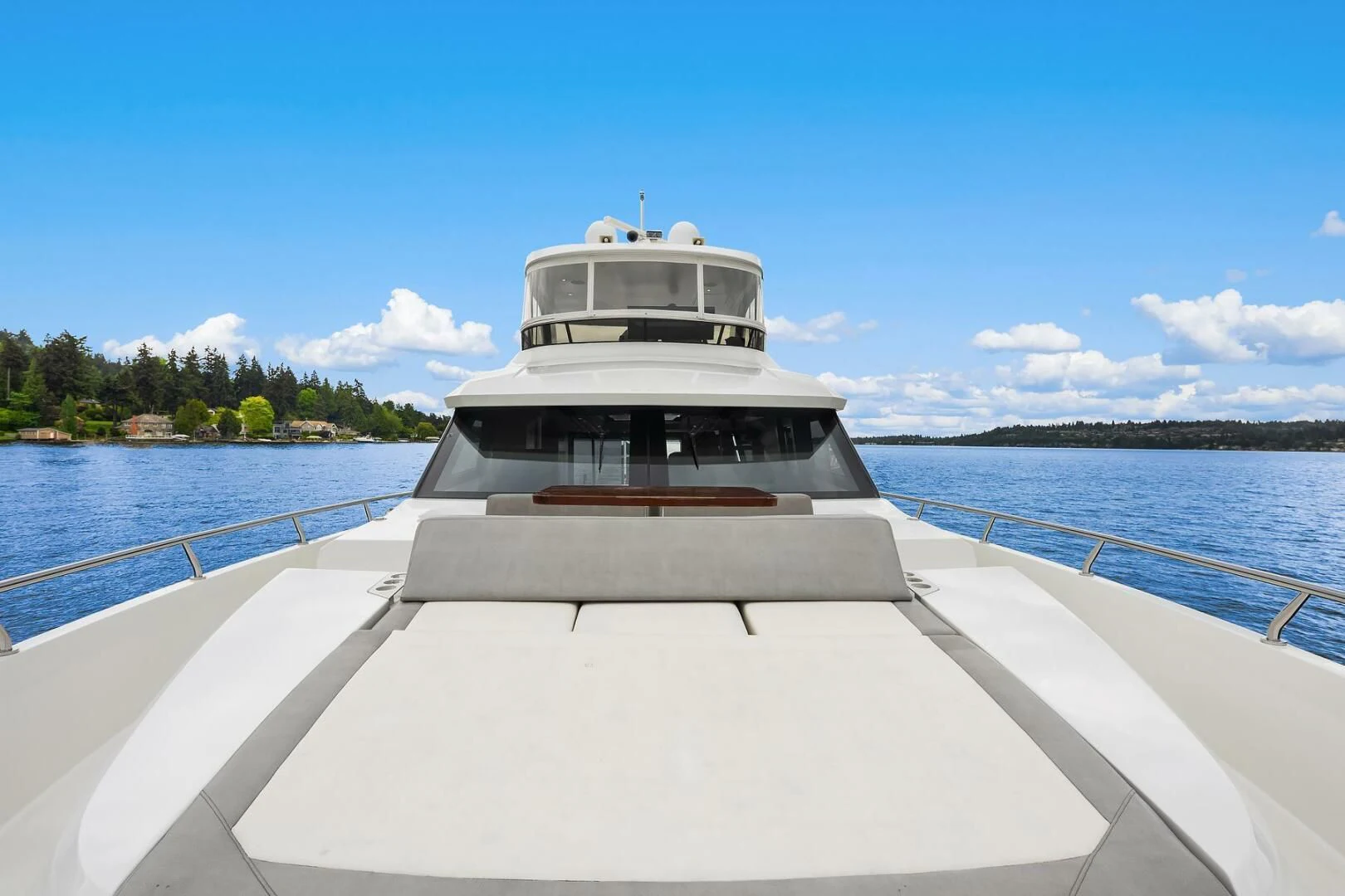 a white boat on a body of water aboard PLAYBOOK Yacht for Sale