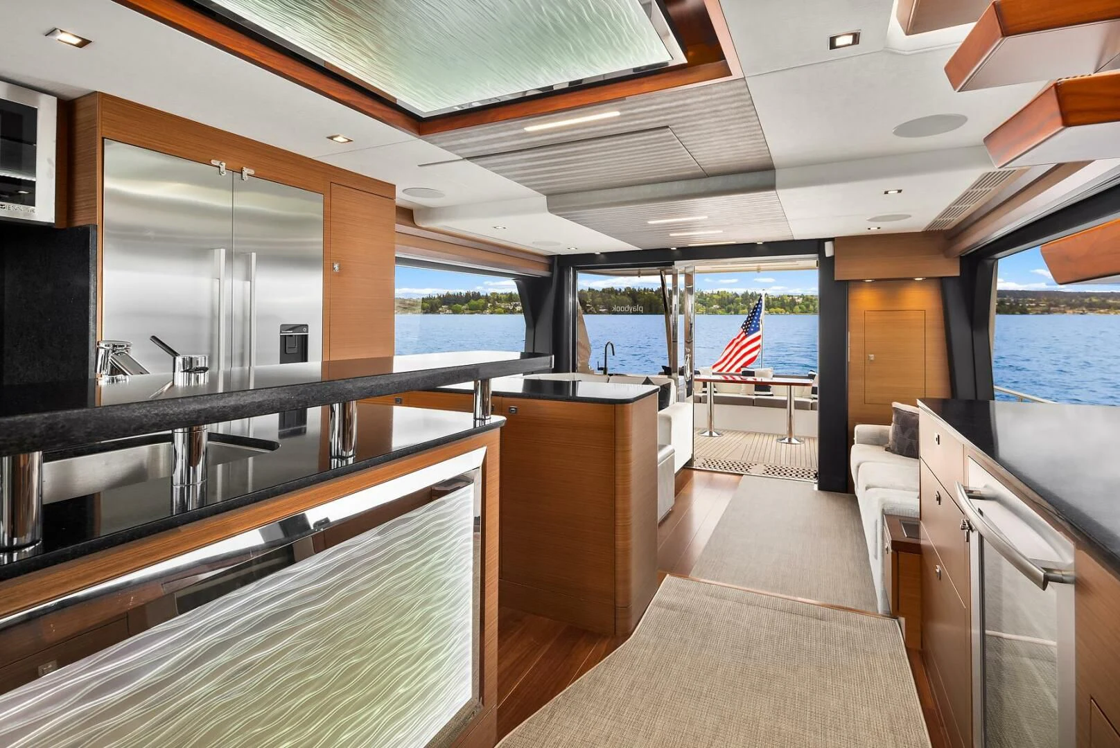a kitchen with a large island aboard PLAYBOOK Yacht for Sale