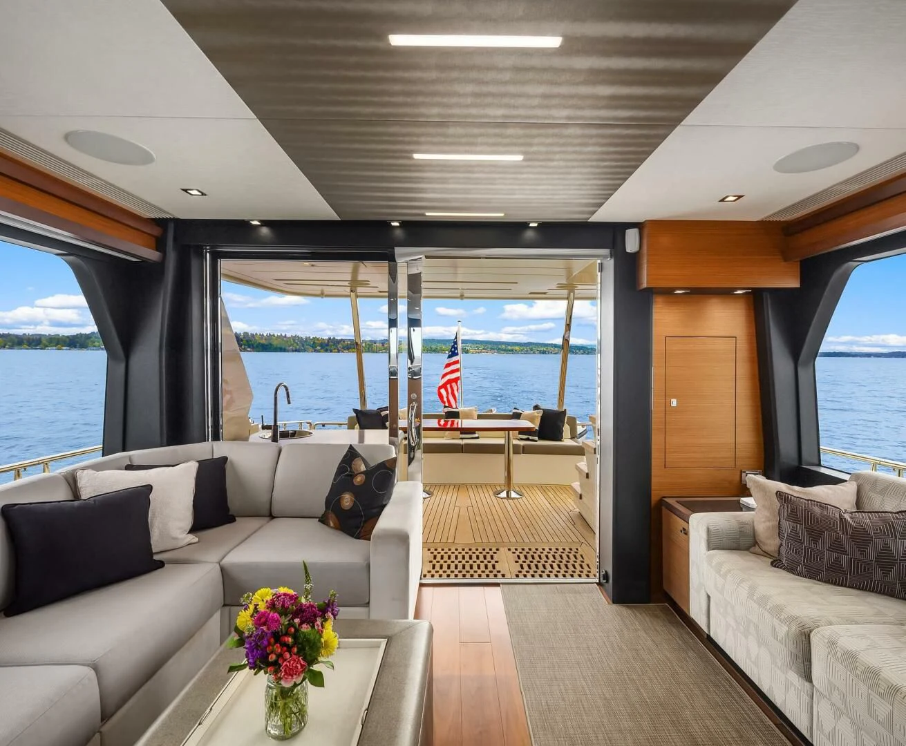 a living room with a large glass window aboard PLAYBOOK Yacht for Sale