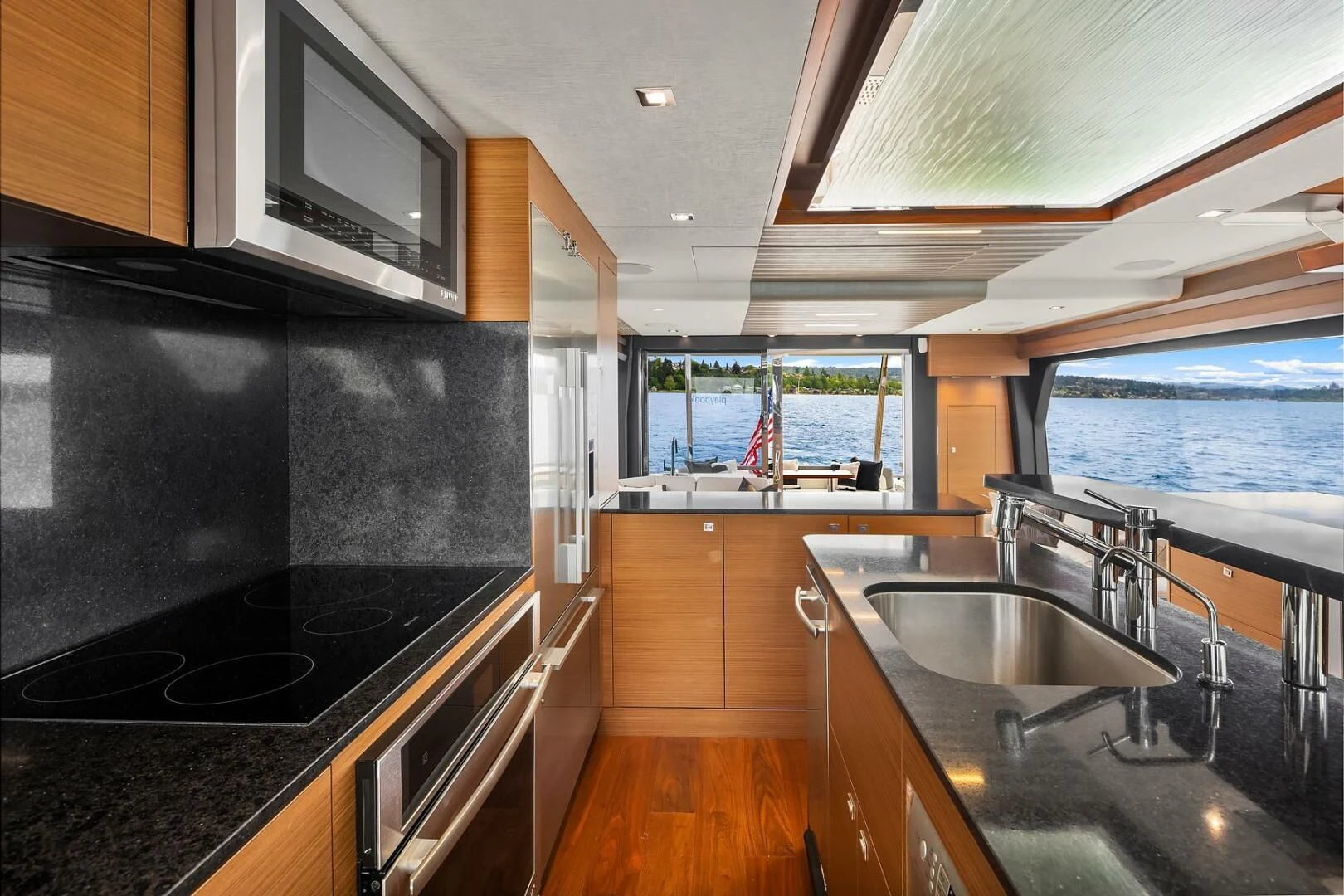a kitchen with a sink and a stove aboard PLAYBOOK Yacht for Sale