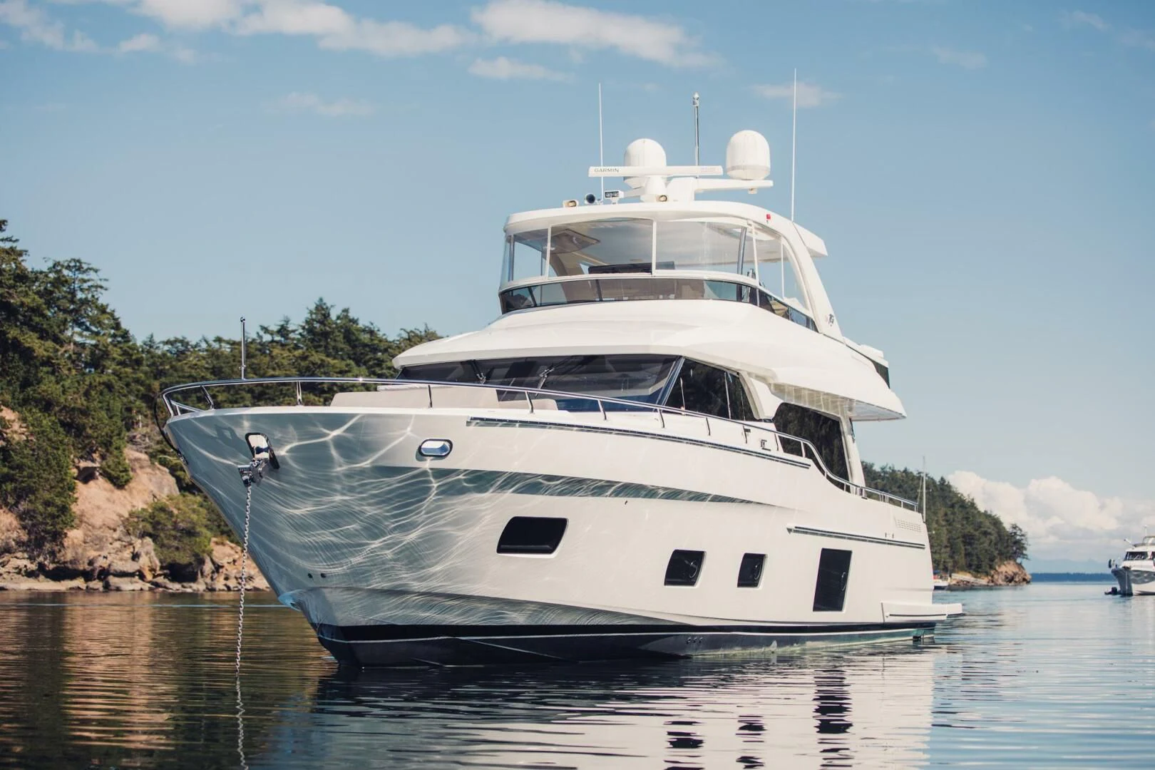 a large white boat in the water aboard PLAYBOOK Yacht for Sale