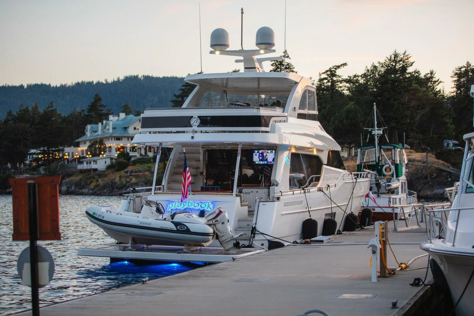 a boat docked at a pier aboard PLAYBOOK Yacht for Sale