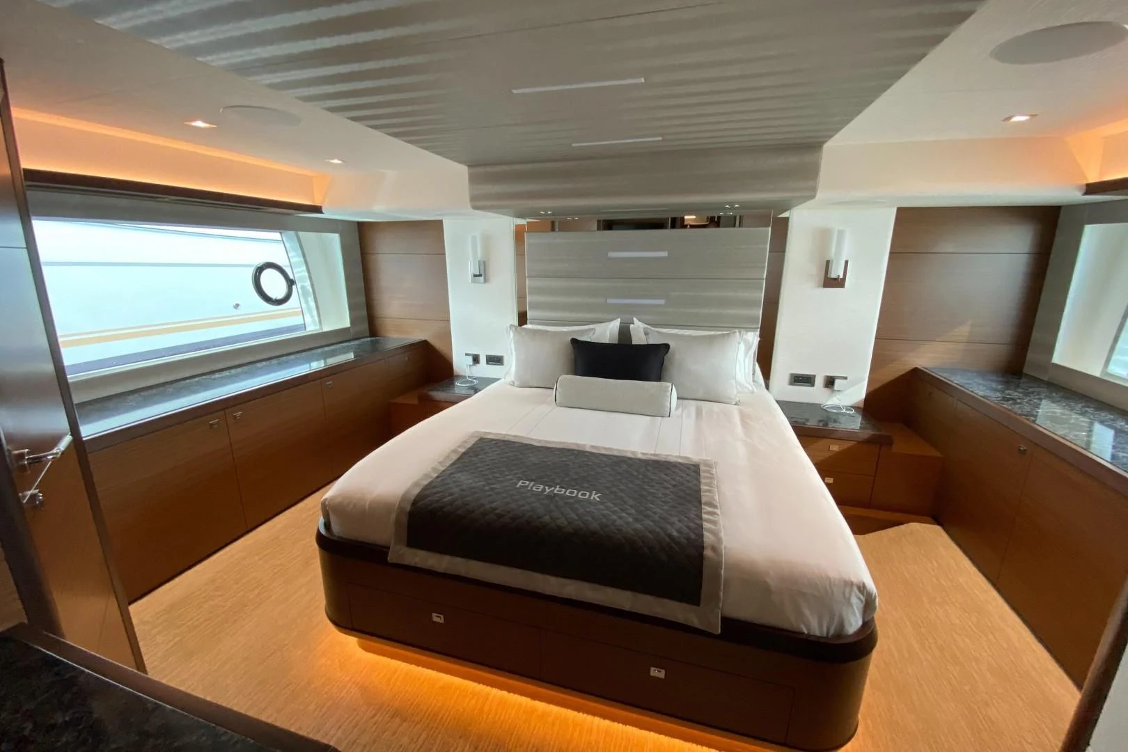 a bedroom with a bed aboard PLAYBOOK Yacht for Sale