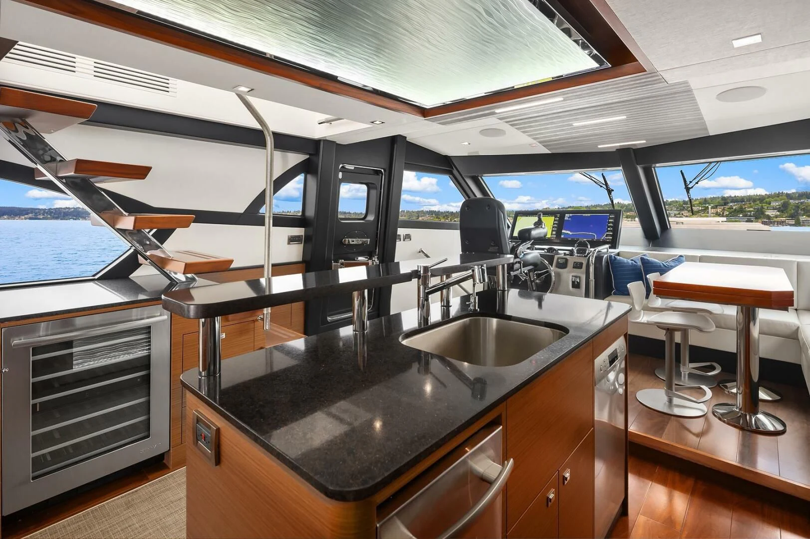 a kitchen with a large island aboard PLAYBOOK Yacht for Sale